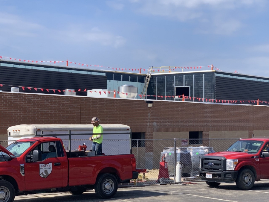 building with two red trucks